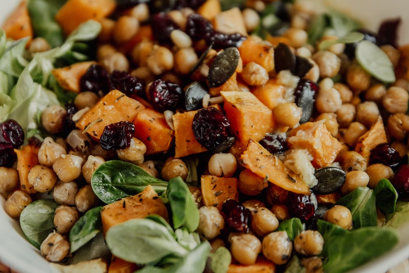 spinach, chickpea, and sweet potato salad with dried cranberries